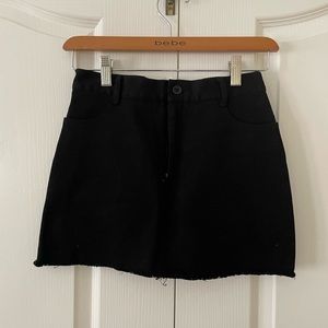 Brandy Melville black jean mini skirt. Size 00. Pockets on fron side and back.